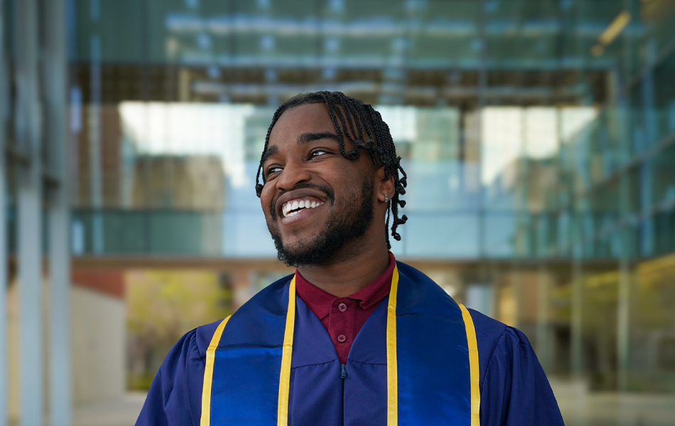 UC Merced grad David poses for a photo