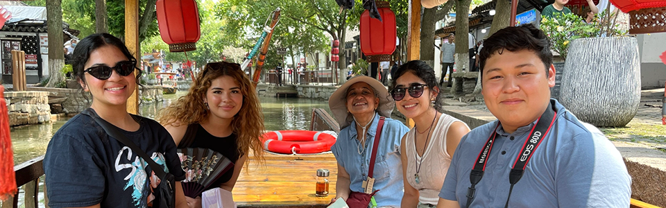 photo of students on a small boat in China